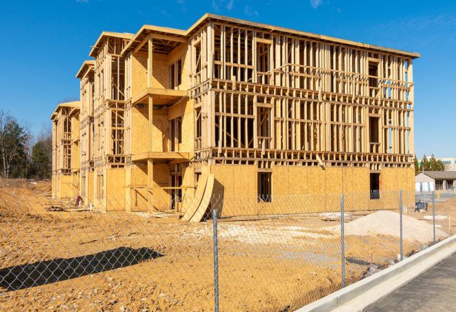 a close-up of temporary chain link fences enclosing a construction site, signaling progress in the project's development in Bayport